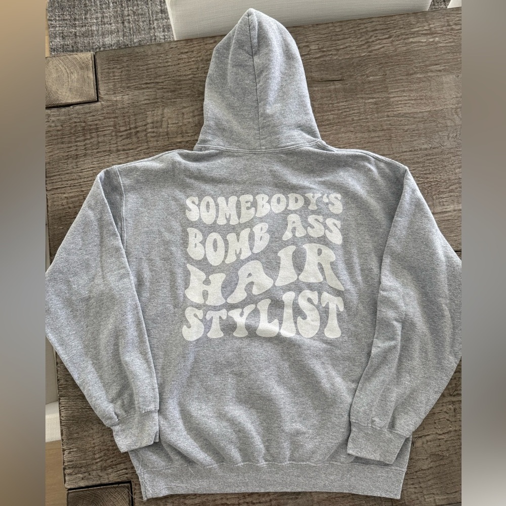 “Somebody’s bomb ass hairstylist” Gildan hoodie size large from ETSY